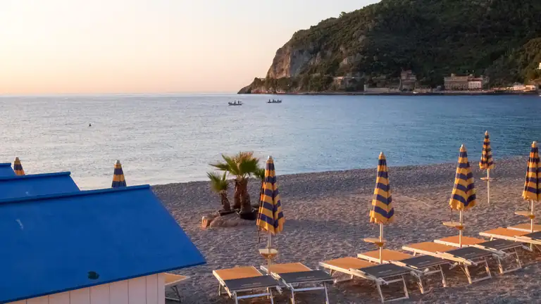 Beach club on Noli beach at sunset