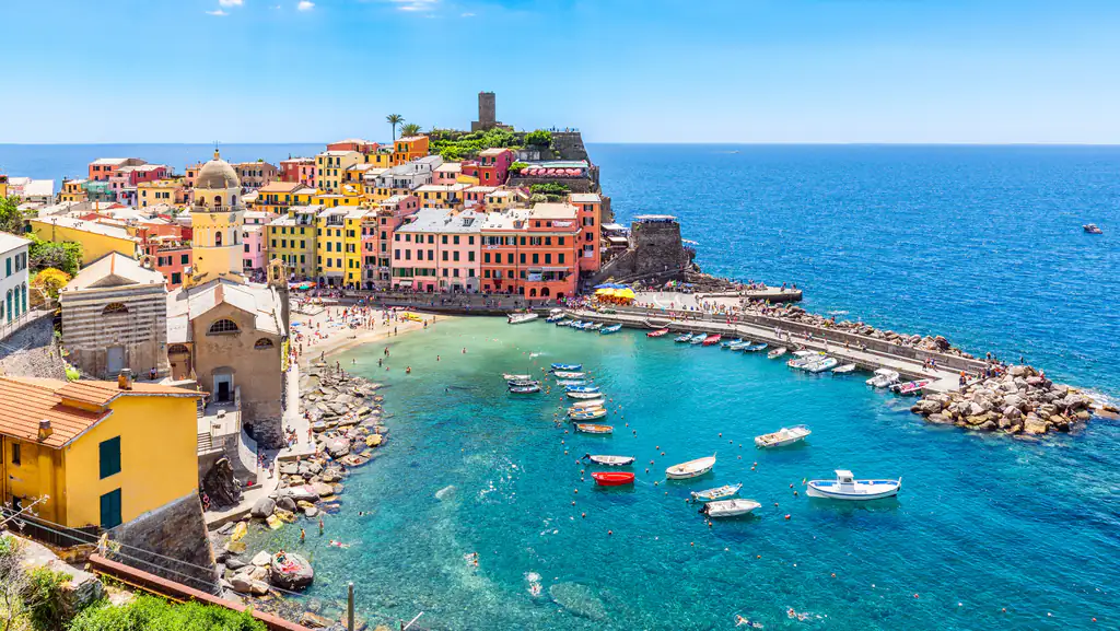 Vernazza with turquoise sea and boats